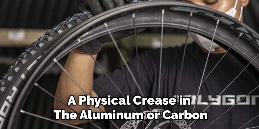 A Physical Crease in 
The Aluminum or Carbon