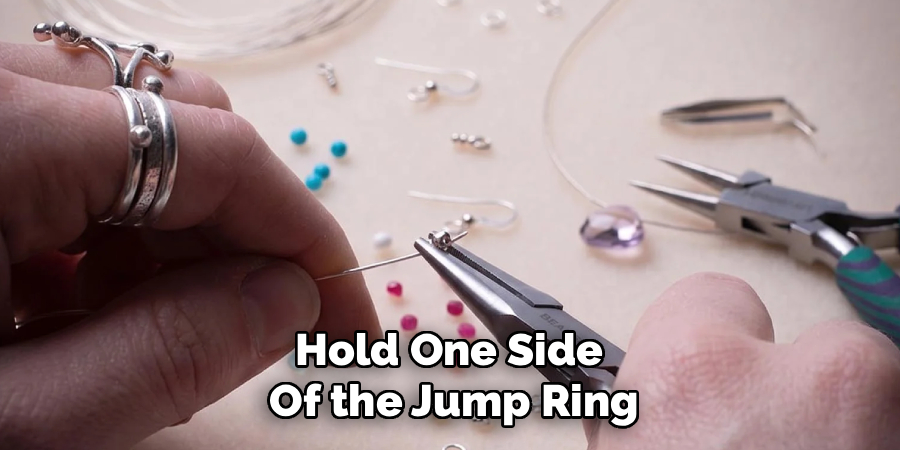 Hold One Side
Of the Jump Ring