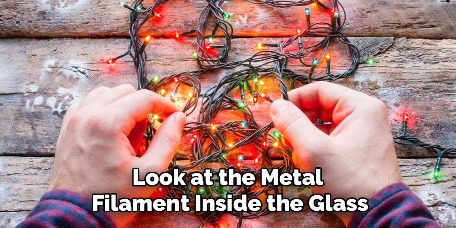 Look at the Metal
Filament Inside the Glass