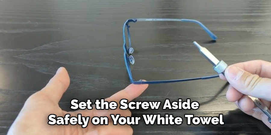 Set the Screw Aside
Safely on Your White Towel
