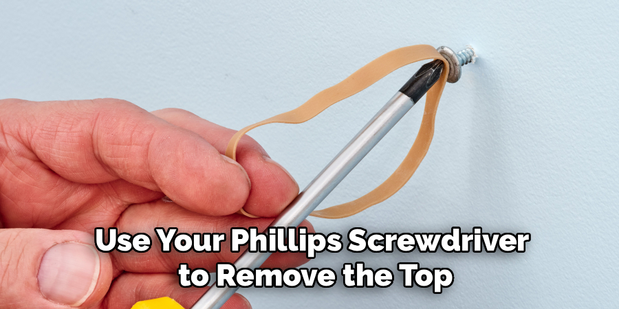 Use Your Phillips Screwdriver
to Remove the Top