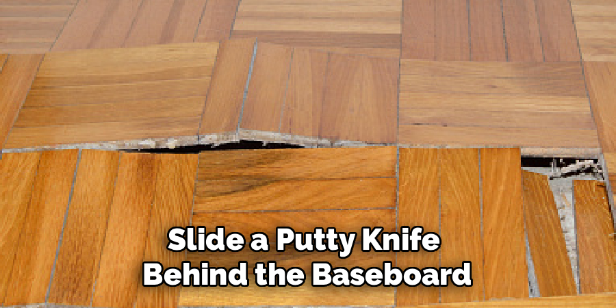 Slide a Putty Knife
Behind the Baseboard