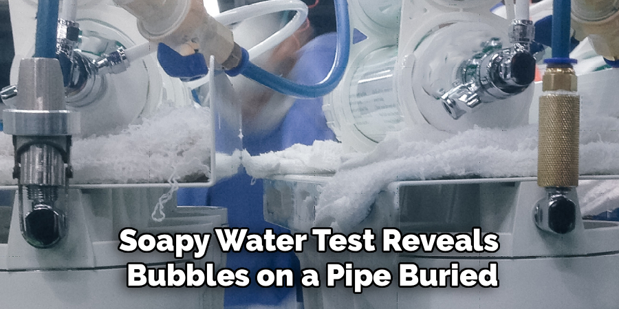 Soapy Water Test Reveals 
Bubbles on a Pipe Buried
