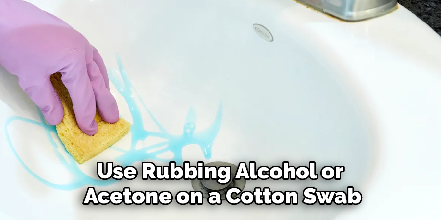 Use Rubbing Alcohol or 
Acetone on a Cotton Swab