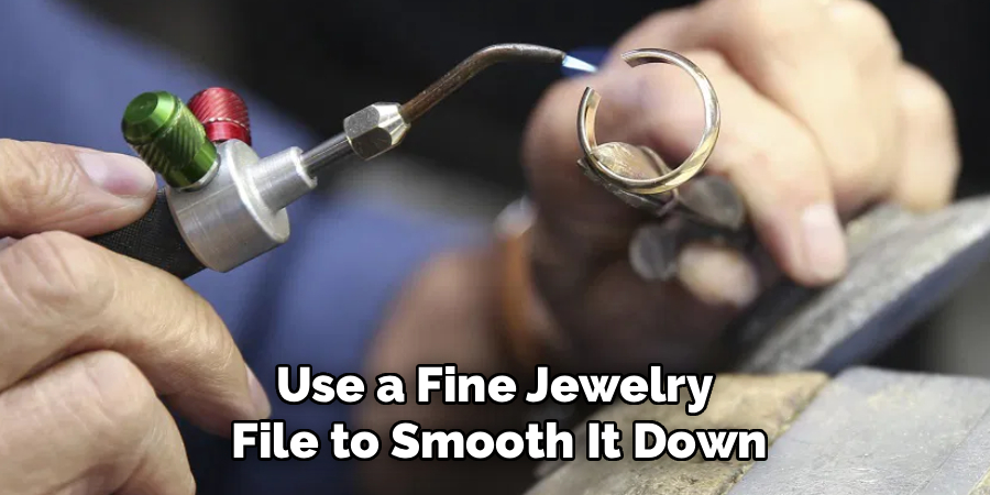 Use a Fine Jewelry
File to Smooth It Down