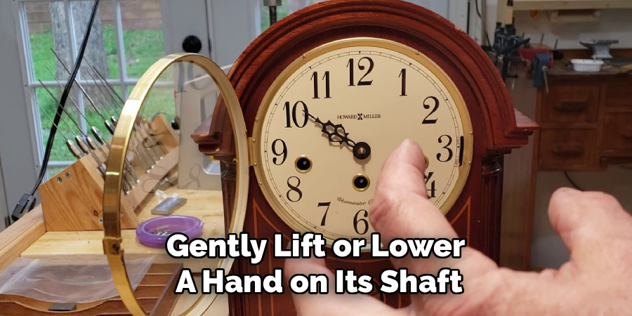 Gently Lift or Lower 
A Hand on Its Shaft