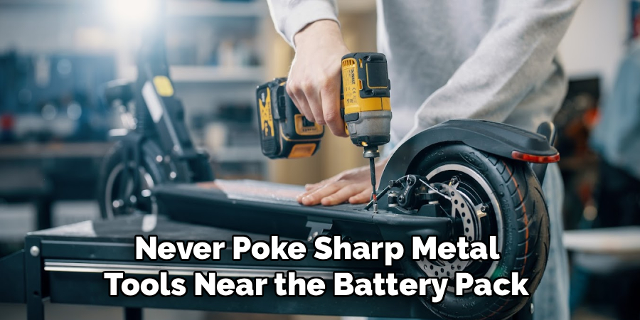 Never Poke Sharp Metal
Tools Near the Battery Pack