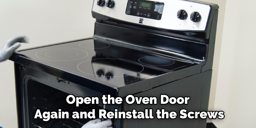 Open the Oven Door 
Again and Reinstall the Screws