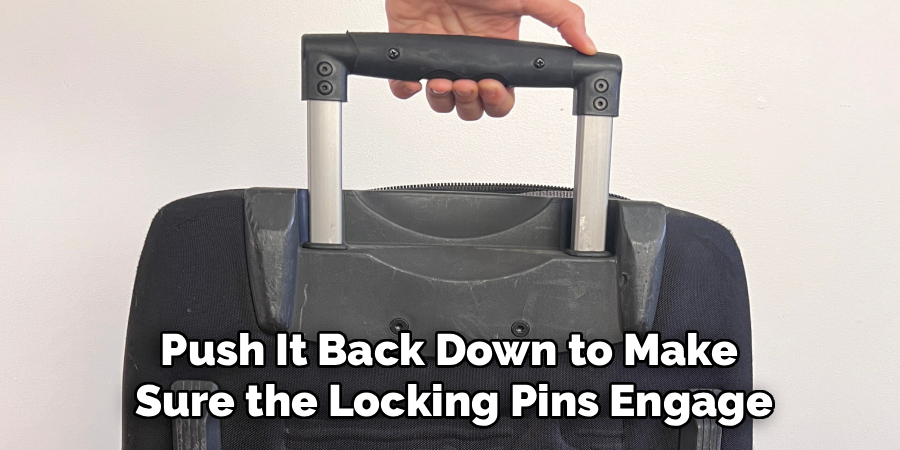 Push It Back Down to Make
Sure the Locking Pins Engage