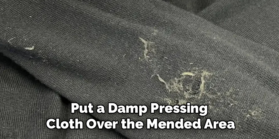 Put a Damp Pressing
Cloth Over the Mended Area
