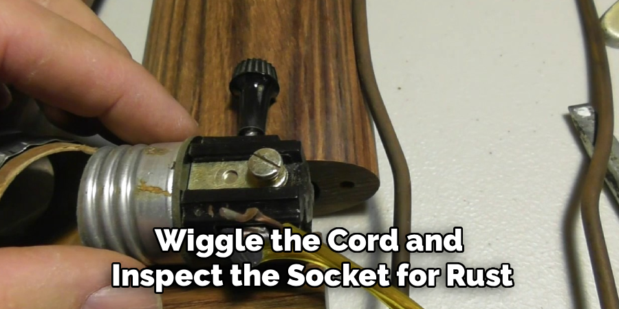Wiggle the Cord and
Inspect the Socket for Rust