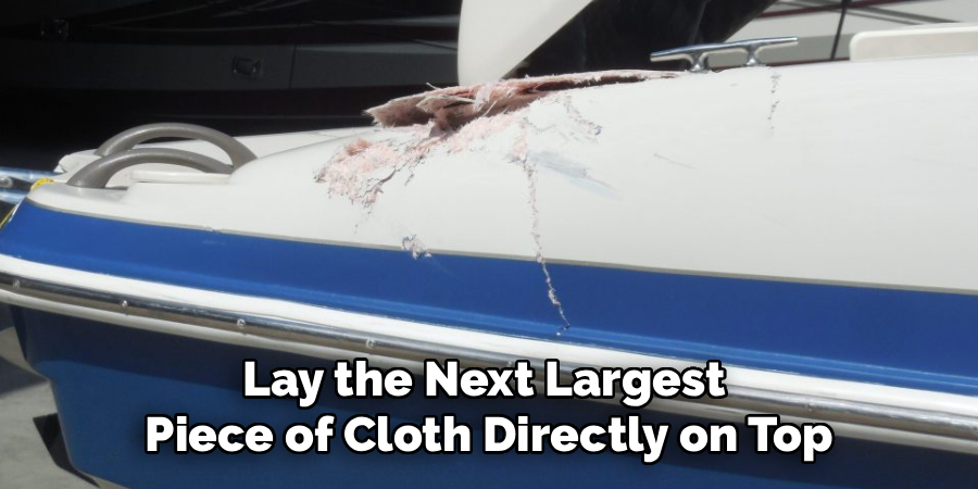 Lay the Next Largest 
Piece of Cloth Directly on Top