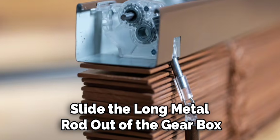 Slide the Long Metal Rod Out of the Gear Box