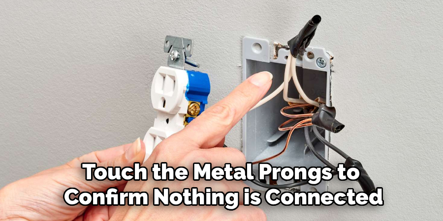 Touch the Metal Prongs to 
Confirm Nothing is Connected