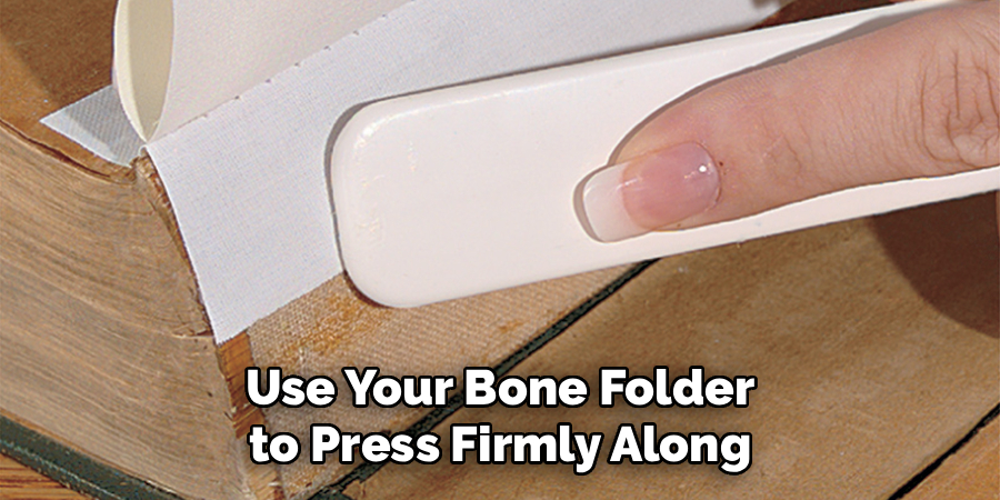 Use Your Bone Folder
 to Press Firmly Along 