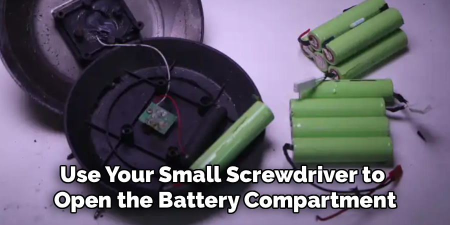 Use Your Small Screwdriver to
Open the Battery Compartment