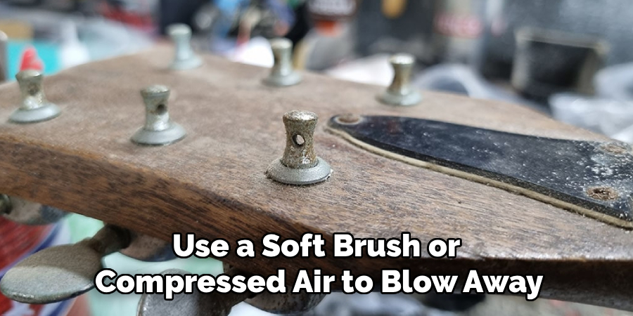 Use a Soft Brush or
Compressed Air to Blow Away