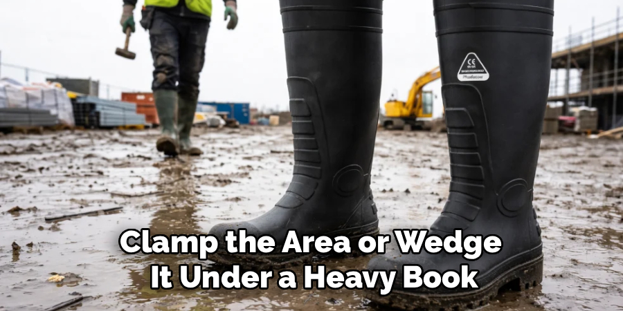 Clamp the Area or Wedge
It Under a Heavy Book