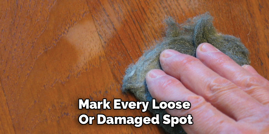Mark Every Loose
Or Damaged Spot
