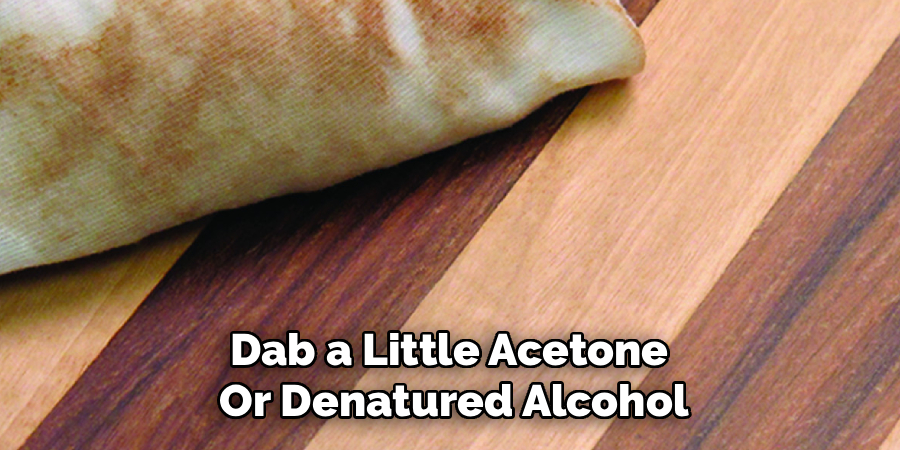 Dab a Little Acetone 
Or Denatured Alcohol