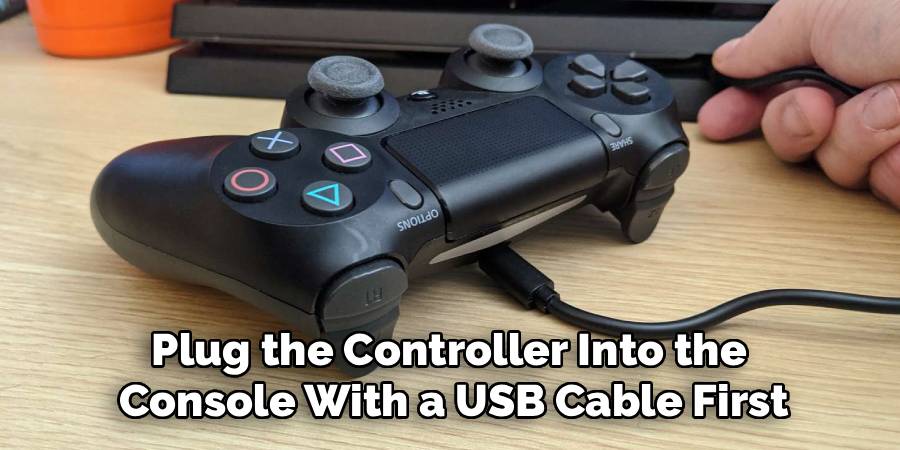 Plug the Controller Into the 
Console With a USB Cable First