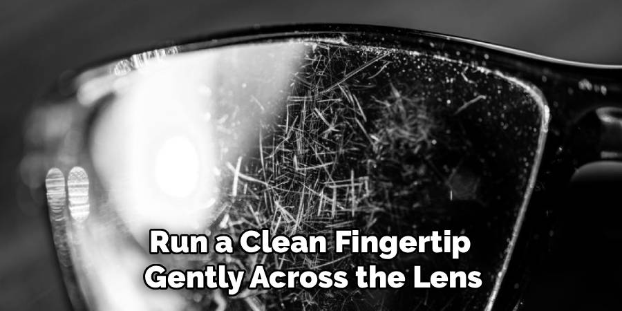 Run a Clean Fingertip 
Gently Across the Lens