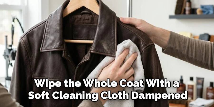 Wipe the whole coat with a soft cleaning cloth dampened