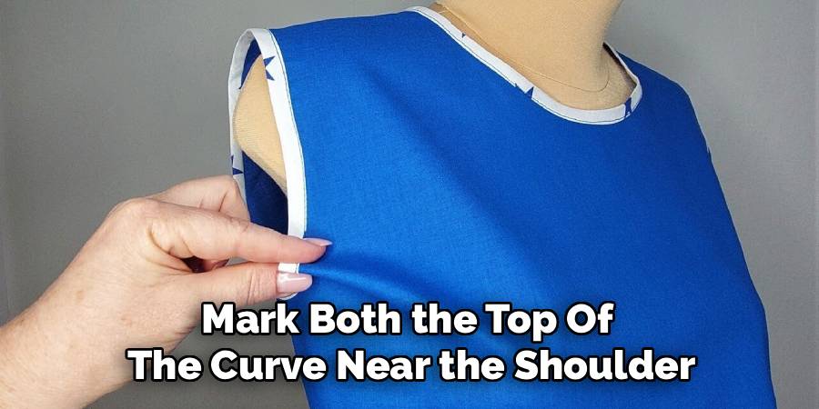 Mark Both the Top Of 
The Curve Near the Shoulder