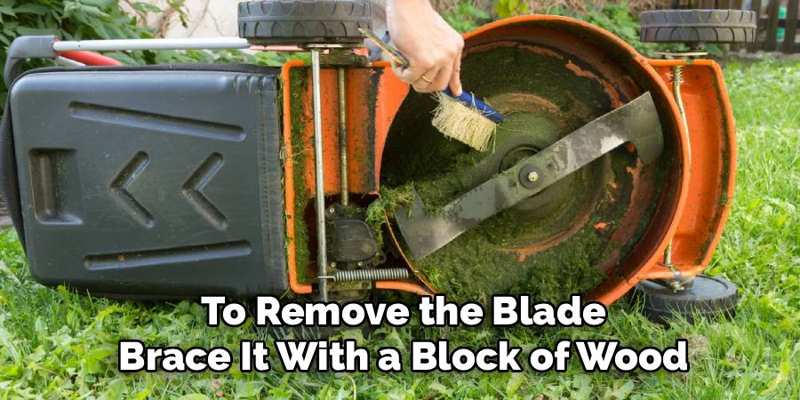To Remove the Blade
Brace It With a Block of Wood